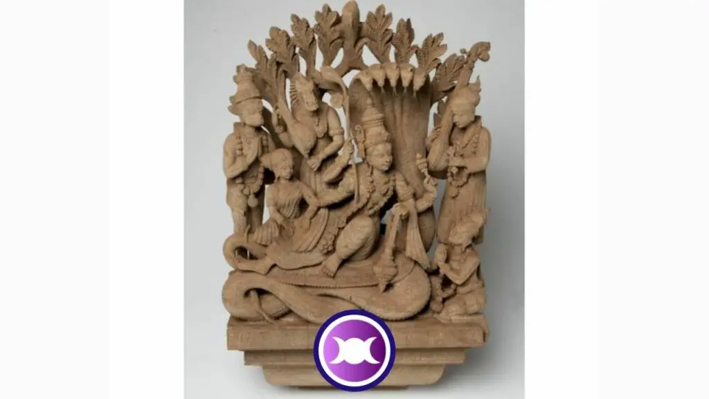 Wooden sculpture of God Vishnu and others in the cosmic ocean